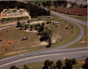 Aerial view of the museum grounds looking south during the summer of 1984. The Heritage Building—a collection of “Butler” buildings from Dobbins Air Force Base—is being assembled at the upper left. 